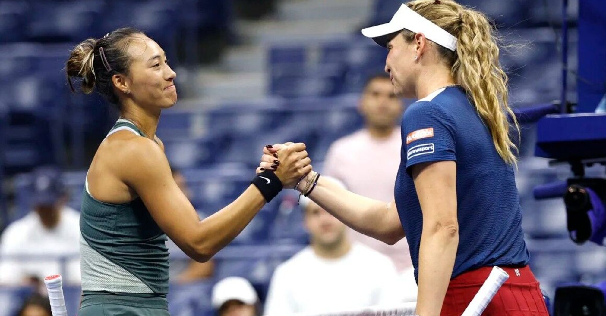 Zheng Qinwen shakes hands with Donna Vekić