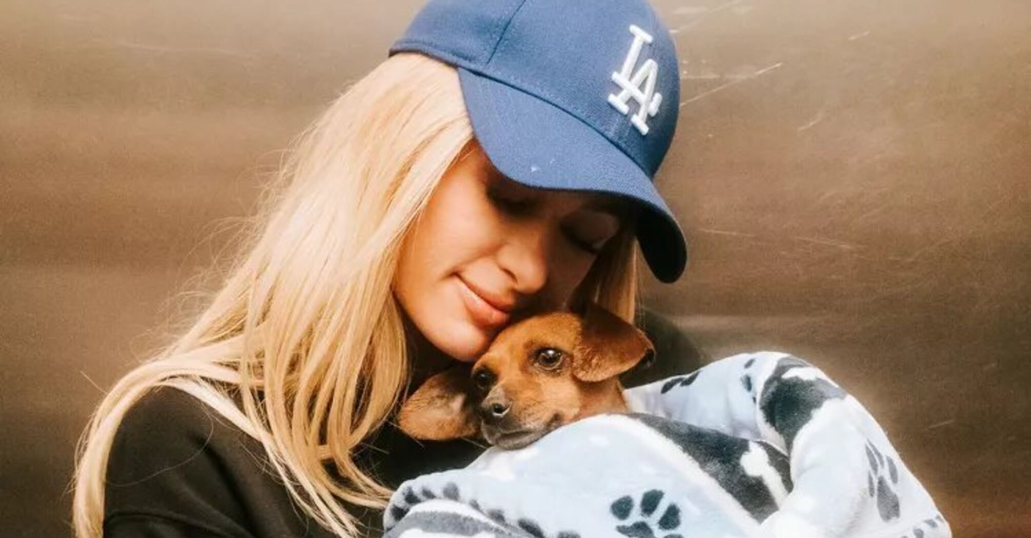 Paris Hilton Enjoys Joyful Car Ride with Foster Dog Zuzu After L.A. Fires