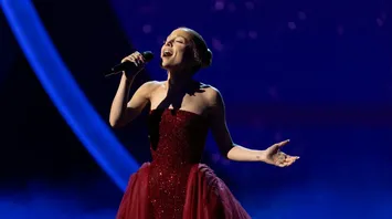 Ariana Grande Honors The Wizard of Oz in Stunning Ruby Red Ensemble at Oscars 2025