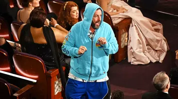 Adam Sandler Crashes the 2025 Oscars in a Hoodie and Basketball Shorts